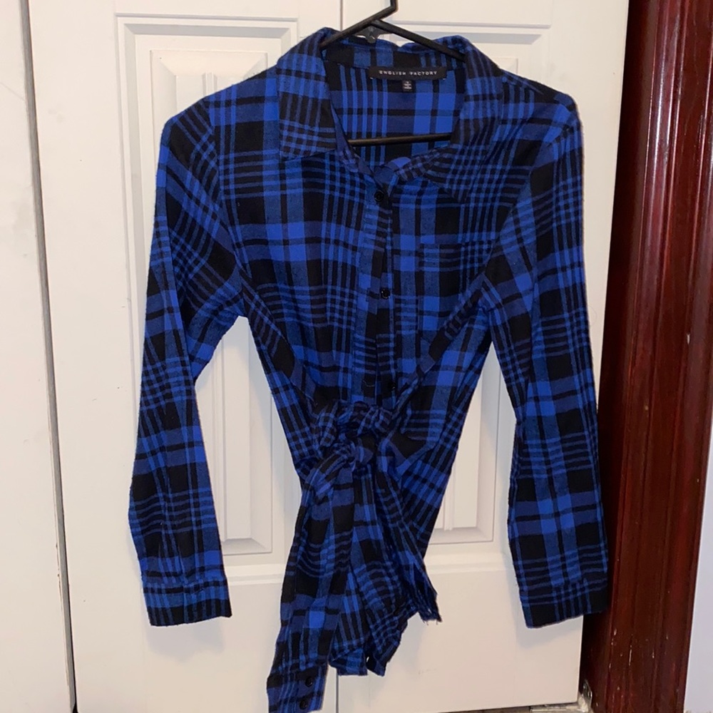 Plaid flannel shirt with tie waist detail.